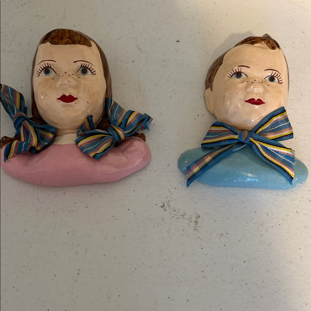 Source Unknown Pink and Blue Ceramic Wall Busts with Striped Bows